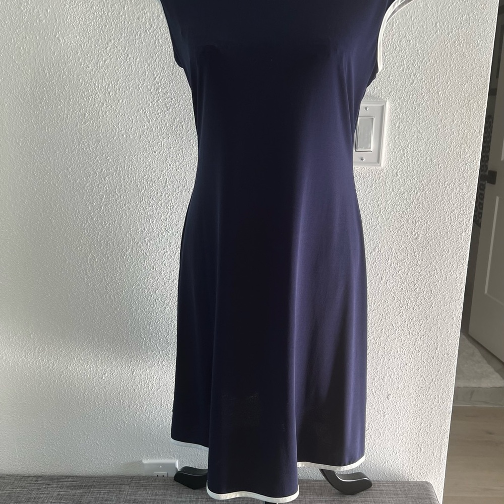 Navy blue dress with white piping trim at armpits and hem. Size M